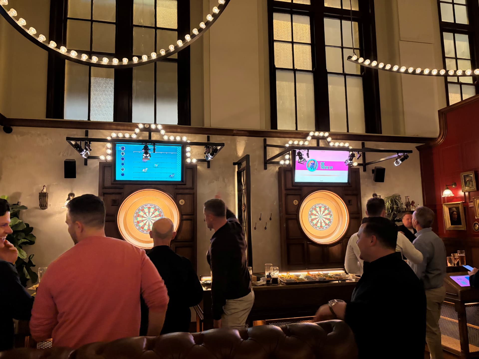 Sales leaders gathered around the boards at the 4Twenty quarterly darts night